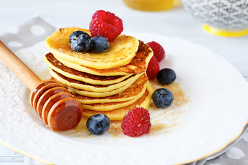 Wall Mural - Pancakes with blueberries and raspberries