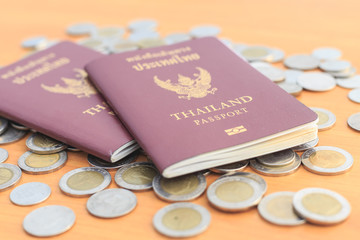 Close up Thailand passport and coin on the table