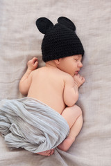 Wall Mural - newborn baby in black mouse hat