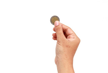 Woman hand holding coin isolates on white background