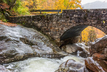 Creek Underneath Stone Bridge In Fall