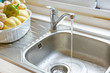Kitchen faucet with a flowing water