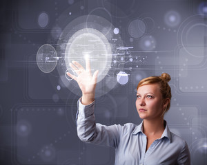 Wall Mural - Attractive businesswoman touching abstract high technology circu