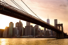 Manhattan Skyline With Brooklyn Bridge At Sunset, New York City