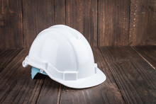 Construction Hard Hat On Wooden Background