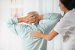 © Mediteraneo - Chiropractic: Chiropractor examining senior man at office