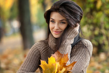 Portrait Of Beautiful Girl On Yellow Leaves. Outdoor