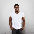 © SFIO CRACHO - Smiling young man in white t-shirt