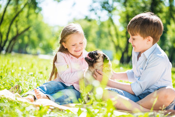 Wall Mural - Children in park with pet