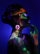 © chettythomas - Woman sensual posing in fluorescent paint makeup
