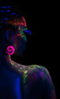 © chettythomas - Back of woman in fluorescent paint makeup