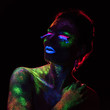 © chettythomas - Red  light contour on the sensual woman with fluorescent paint