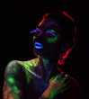© chettythomas - Red  light contour on the sensual woman with fluorescent paint