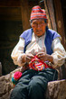 Old men knitting at taquile island in puno peru.