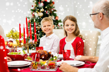 Wall Mural - smiling family having holiday dinner at home