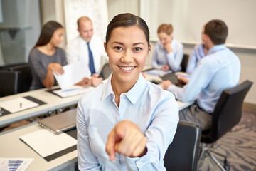 Canvas Print - group of smiling businesspeople meeting in office