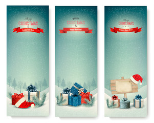 Poster - Three Christmas banners with presents. Vector.