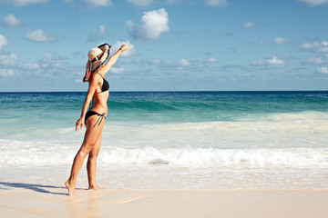 Sticker - Woman in hat on the beach.