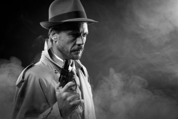 Wall Mural - Film noir: detective in the dark with a gun