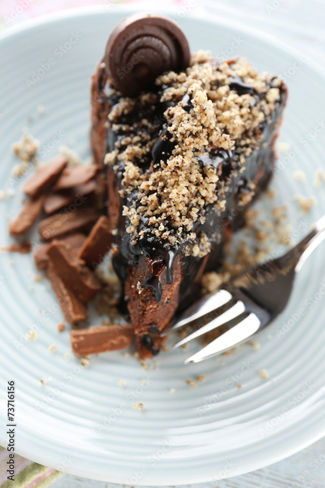 Yummy chocolate cake served on table