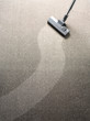 Vacuum cleaner on a carpet with a extra clean strip