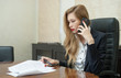business woman talking phone in conference room