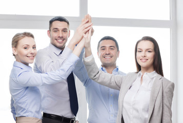 Canvas Print - happy business team giving high five in office