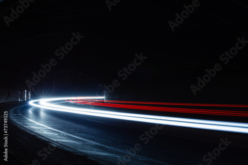 light trails in tunnel. Art image. Long exposure photo taken in Poster
