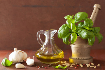 Wall Mural - ingredients for pesto sauce over wooden rustic background