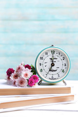 Wall Mural - Beautiful flowers with clock and book