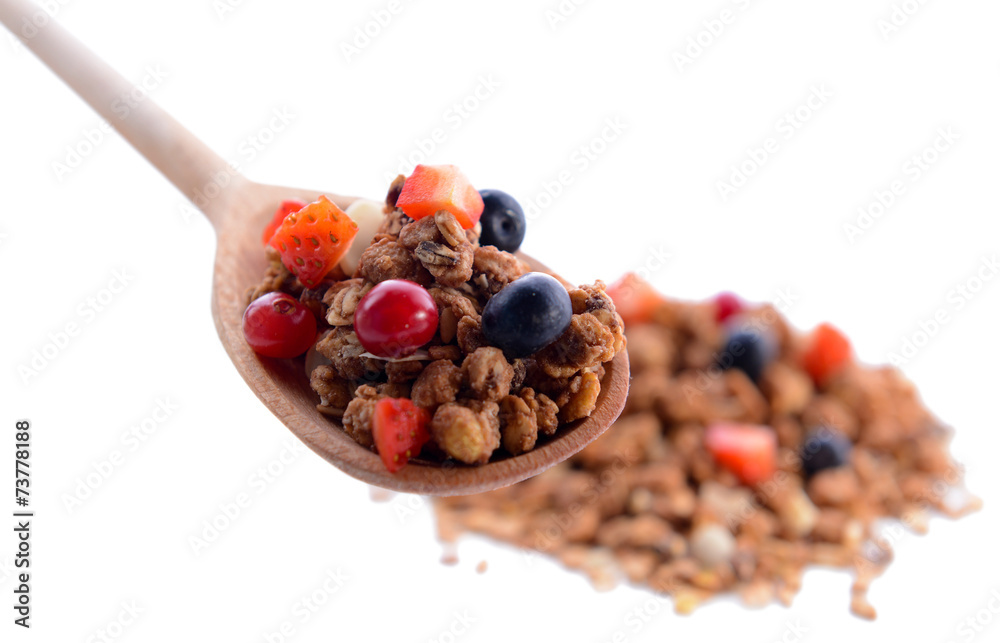 Granola in spoon isolated on white