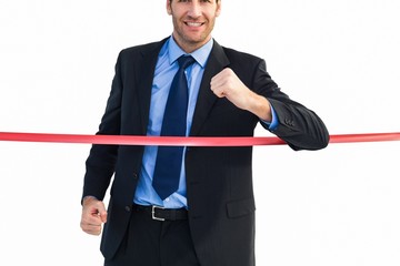 Poster - Happy businessman crossing finishing line