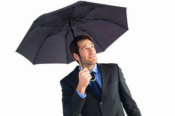 Poster - Businessman sheltering with black umbrella
