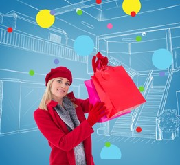 Poster - Blonde in winter clothes holding shopping bags