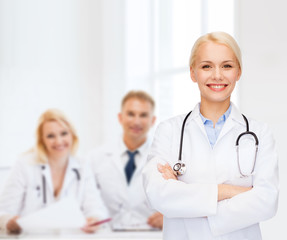 Poster - smiling female doctor with stethoscope