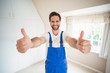 © WavebreakMediaMicro - Handyman smiling at camera showing thumbs up
