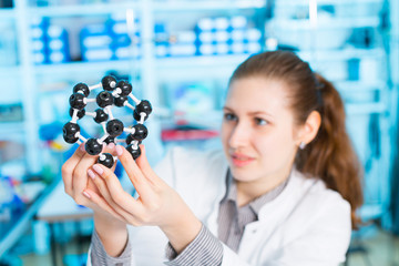 Wall Mural - young woman scientist working at the laboratory.