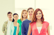© Syda Productions - smiling students with teenage girl in front