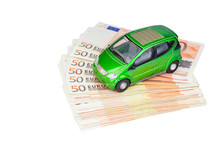 Green Model Car On Pile Of Euro Bills