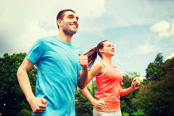 Poster - smiling couple running outdoors