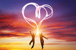 © Photocreo Bednarek - Happy couple in love jump making heart symbol of light