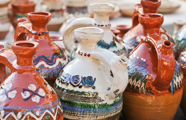 romanian traditional pottery handcrafted mugs at a souvenir shop