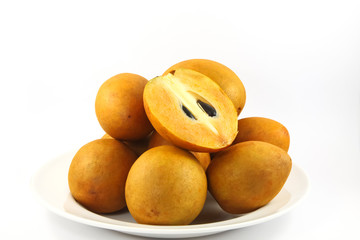 fresh Sapodilla fruits on white background