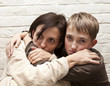 © Denizo - Violence in the family. Mother soothes her son
