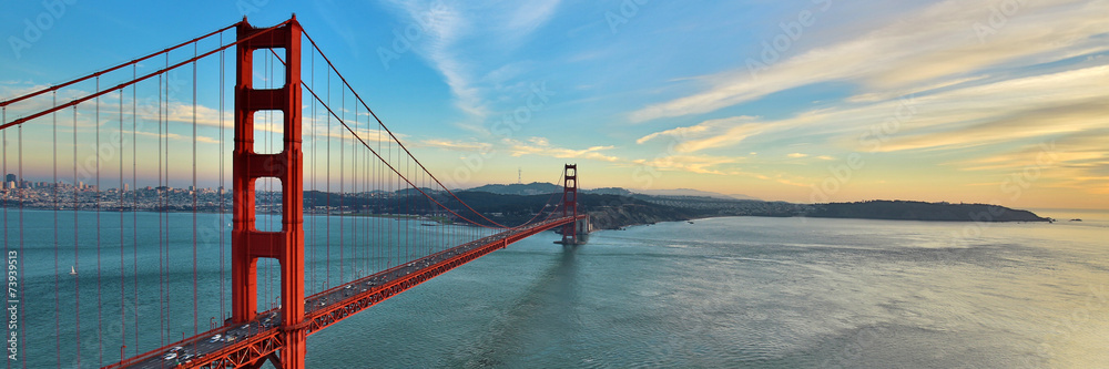 Golden Gate Bridge panorama, San Francisco California, sunset light on cloudy sky  - obrazy, fototapety, plakaty 