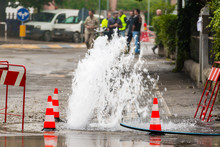 Road Spurt Water Beside Traffic Cones