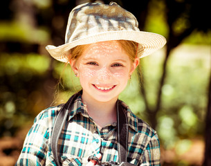 Wall Mural - little girl in a hat