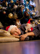 © Denizo - A boy sleeps under the Christmas tree