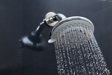 Shower Head In Bathroom With Water Drops Flowing