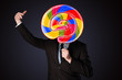 © ra2 studio - Businessman holding a lollipop